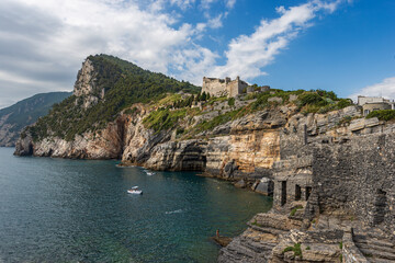 Fototapeta na wymiar Ancient Doria Castle (1164-XIX century) of Porto Venere or Portovenere town, UNESCO world heritage site, on the rocky coastline along the Mediterranean Sea. La Spezia, Liguria, Italy, Europe.