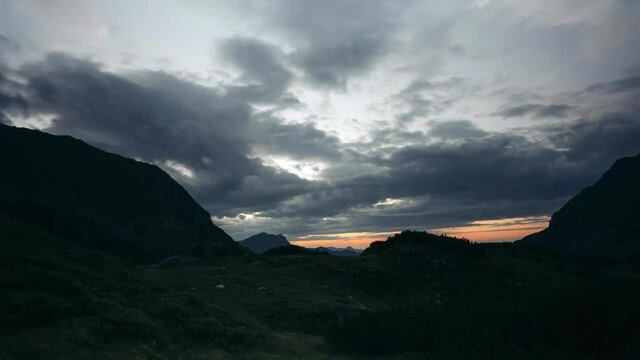Timelapse - Dark clouds rolling in on a mountain landscape in Austria