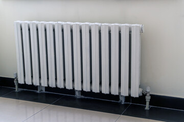 White heating radiator on wall background