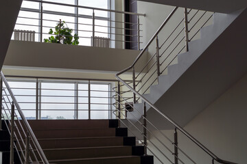Large windows and stairs in an office building
