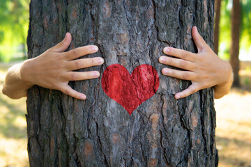 Hugging a tree with a heart symbol - Powered by Adobe