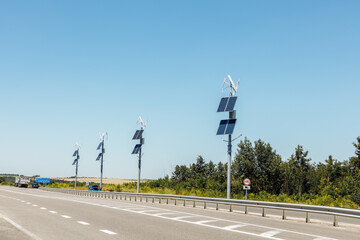 Wind turbines and solar panels, solar panels and wind turbine against blue sky renewable energy