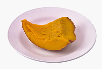 Steamed pumpkin in plate isolated on white background.