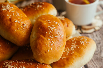 Pies with onions and eggs. Russian national dish. Delicious pies on a wooden table 