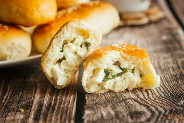 Pies with onions and eggs. Russian national dish. Delicious pies on a wooden table 