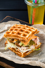 Restaurant Hot Starter Food Waffle Sandwich. Waffle Sandwich viennese waffles with ham, lettuce and pickled cucumber