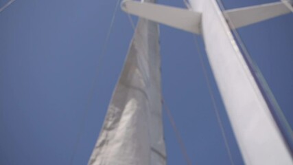 white sail develops in the wind