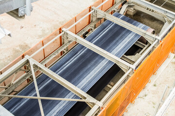Closeup shot of a conveyor belt equipment on industrial mining site