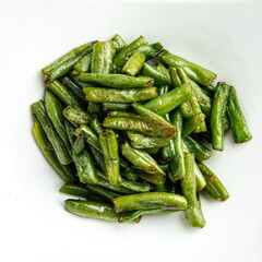 Isolated portion of fried green string beans garnish on white background