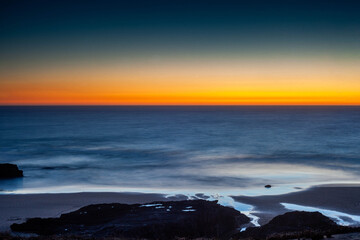Praia do Malhão in Vila Nova de Mil Fontes Portugal, at sunset.