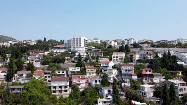 Aerial drone view of apartments in tourist place. Houses built on the hill. City of Neum in Bosnia and Herzegovina.  