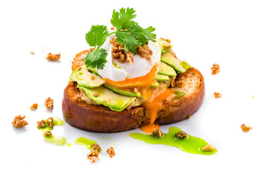 sandwich with poached egg and avocado isolated on a white background