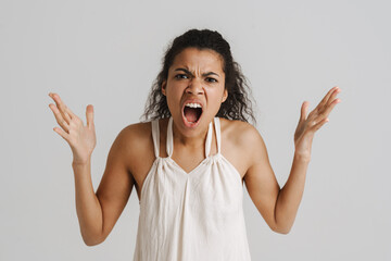 Black young woman screaming at camera with hands up