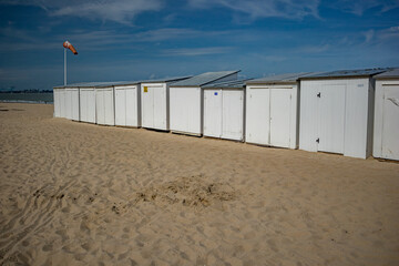 White beautiful row of wooden cabins at the beach, sunny day at Oostende, Belgium