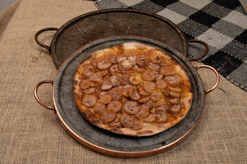 Sweet Brazilian pizza with banana, cinnamon and sugar