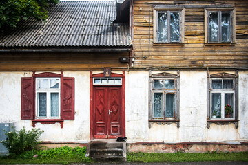 Fototapeta na wymiar Old historical house and cat in Valdemarpils town, Latvia.
