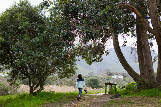 young boy walking near  Klein River, Stanford, Western Cape, South Africa