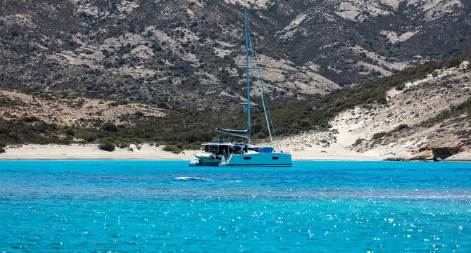 Polyaigos volcanic white sand beach turquoise sea blue sky at Kimolos island, Cyclades Greece.