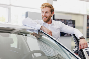 Pensive man customer buyer businessman client in white shirt look aside get out car chooses auto want buy new automobile in showroom vehicle salon dealership store motor show indoor Car sales concept.