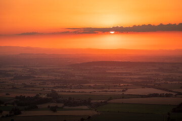 July sunset over the Shropshire Hills from the summit of the Wrekin near Telford West Midlands, England