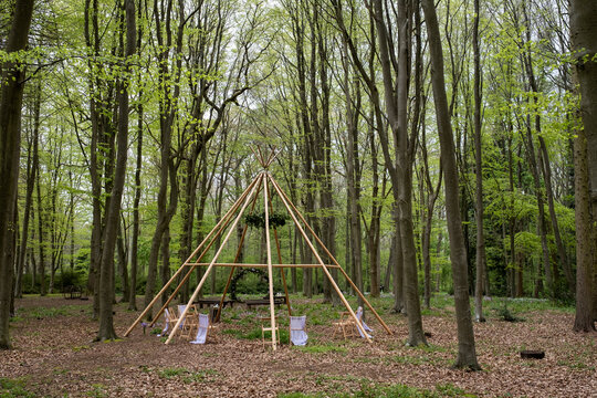 Wooden structure with wreath for a woodland naming ceremony.