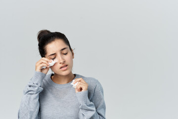 woman in sweater handkerchief cold infection discontent