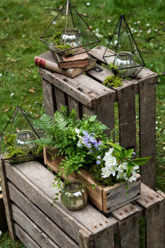 Crate with wild flowers, decorations for a woodland naming ceremony.