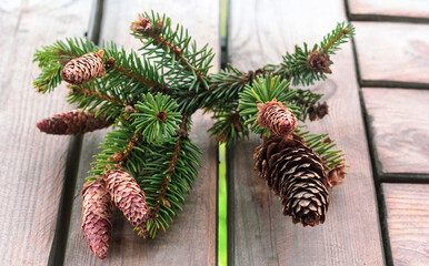 Fir cones on wooden planks, background decoration