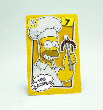 The Simpsons. Homer Jay Simpson. Playing card with the image of the character from the animated series created by cartoonist Matt Groening. Cartoon. Husband of Marge and father of Bart, Lisa and Maggi