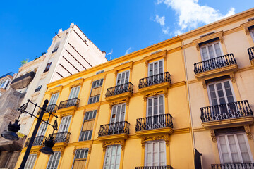 Spanish residential house in Valencia . Windows balcony and yellow wall 