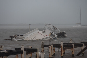 Hurricane Grace. A shot in the rain of damage to the Cayman Islands including these boats that were...