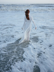 Woman in white dress beach ocean walk fresh air