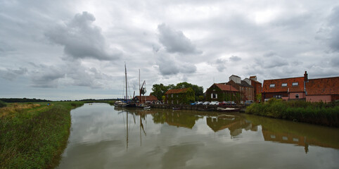 Fototapeta na wymiar Snape Maltings and the river Alde Suffolk on a cloudy day.