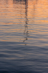 sunset on the sea over the port in Aegina in Greece