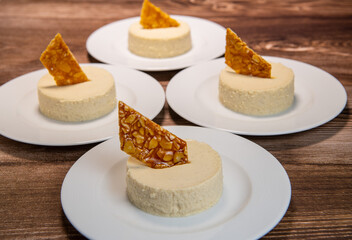 Bavarian recipe with pear and vanilla served with almond nougatine. High quality photo