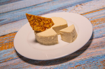 Bavarian recipe with pear and vanilla served with almond nougatine. High quality photo