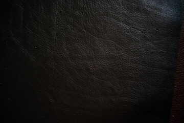 Dark brown genuine leather texture cow skin background