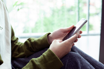 Closeup woman hand touch screen on smart phone, marketing technology and business concept.