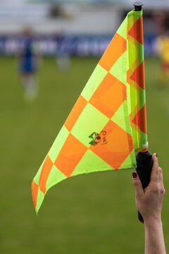 Soccer Referee Raising Hand With Signal Flag