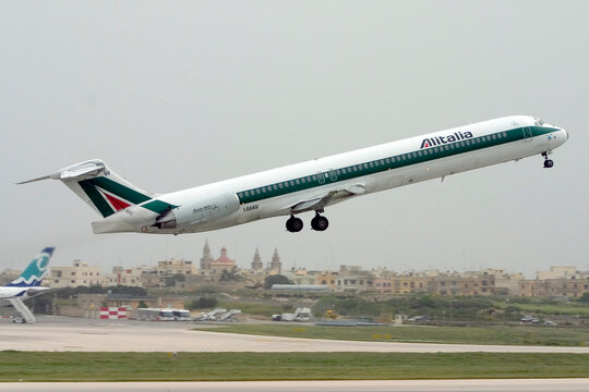 Luqa, Malta - April 10, 2005: Alitalia McDonnell Douglas MD-82 (DC-9-82) (Reg.: I-DANV) taking off on a cloudy day.