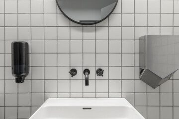 Modern contemporary public restroom minimal interior with metro style white tiles, round mirrors