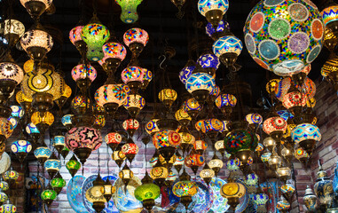 Traditional handmade turkish lamps in souvenir shop. Mosaic of colored glass