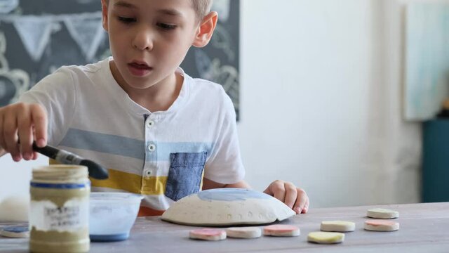 workshop for kids. Children learning how to use clay for making beautiful dishes. Workshop, master class.