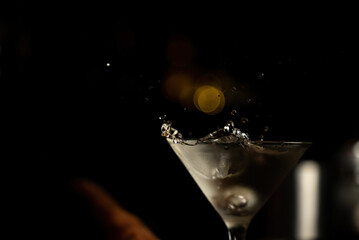 Martini splashing in glass