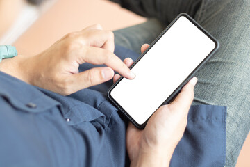 Man's hands holding or using smartphone with two hands. Smartphone with white blank on screen, Cellphone mockup.