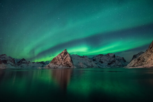 Background, beautiful northern lights in the night sky in Iceland.