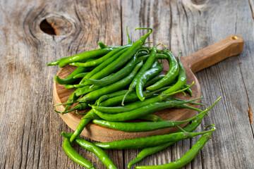 fresh ripe green pepper on wood background