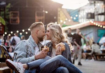 couple is relaxing in an open cafe