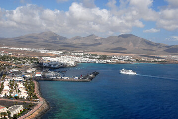Fototapeta na wymiar Fotografía aérea de Playa Blanca en la costa sur de Lanzarote, Canarias