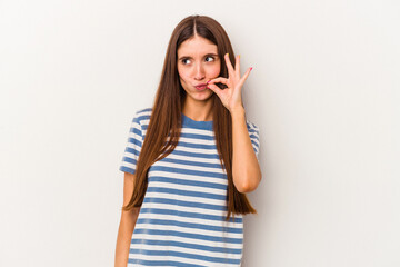 Young caucasian woman isolated on white background with fingers on lips keeping a secret.